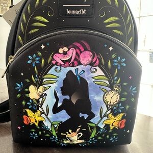 New Alice in wonderland Loungefly   Solid pink interior.